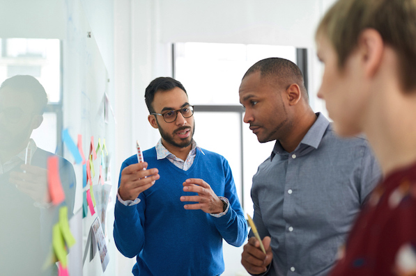 Customer service managers discussing customer experience design and strategy best practices